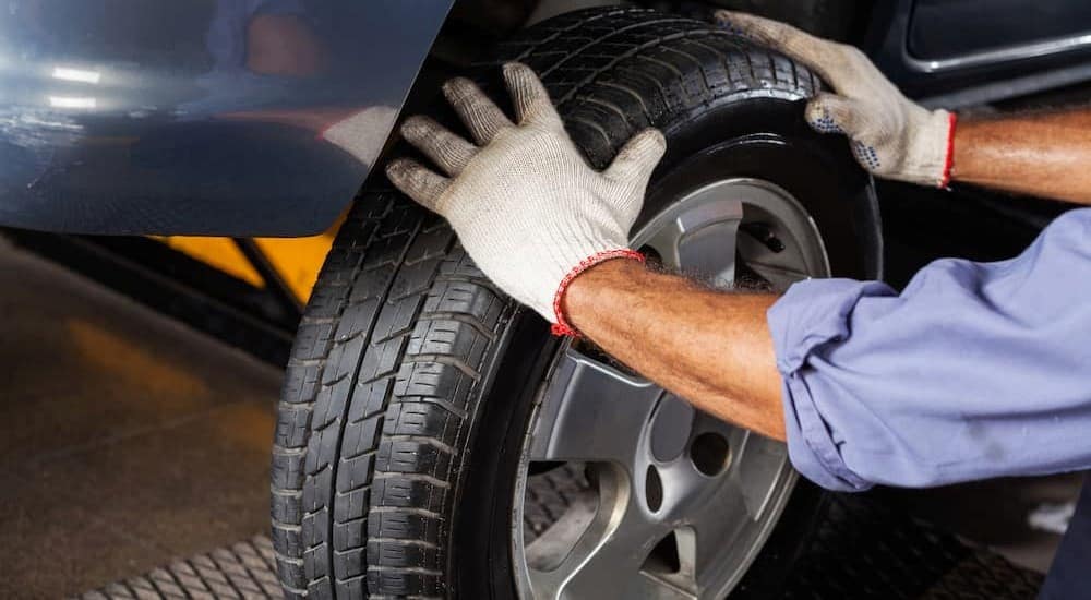 Technician replacing set of tires